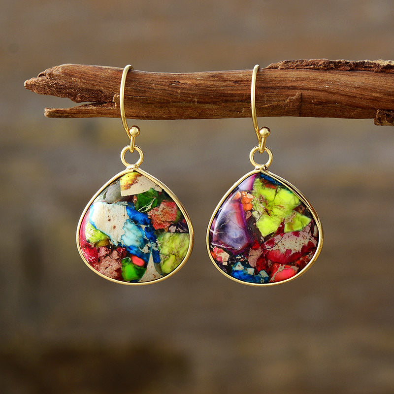 18K gold-plated natural stone earrings with vibrant colors, featuring teardrop design on a wooden background.