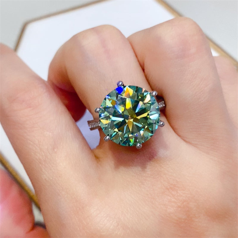 Stunning 10 carat moissanite ring set in 925 sterling silver, showcasing vibrant colors and elegant design on a hand.