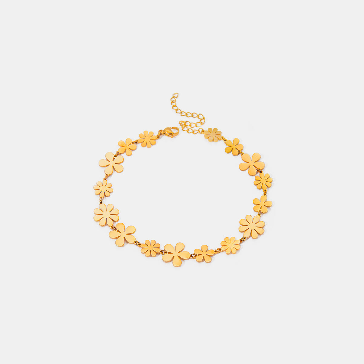 18K gold-plated flower bracelet featuring multiple floral designs and an adjustable extension chain.